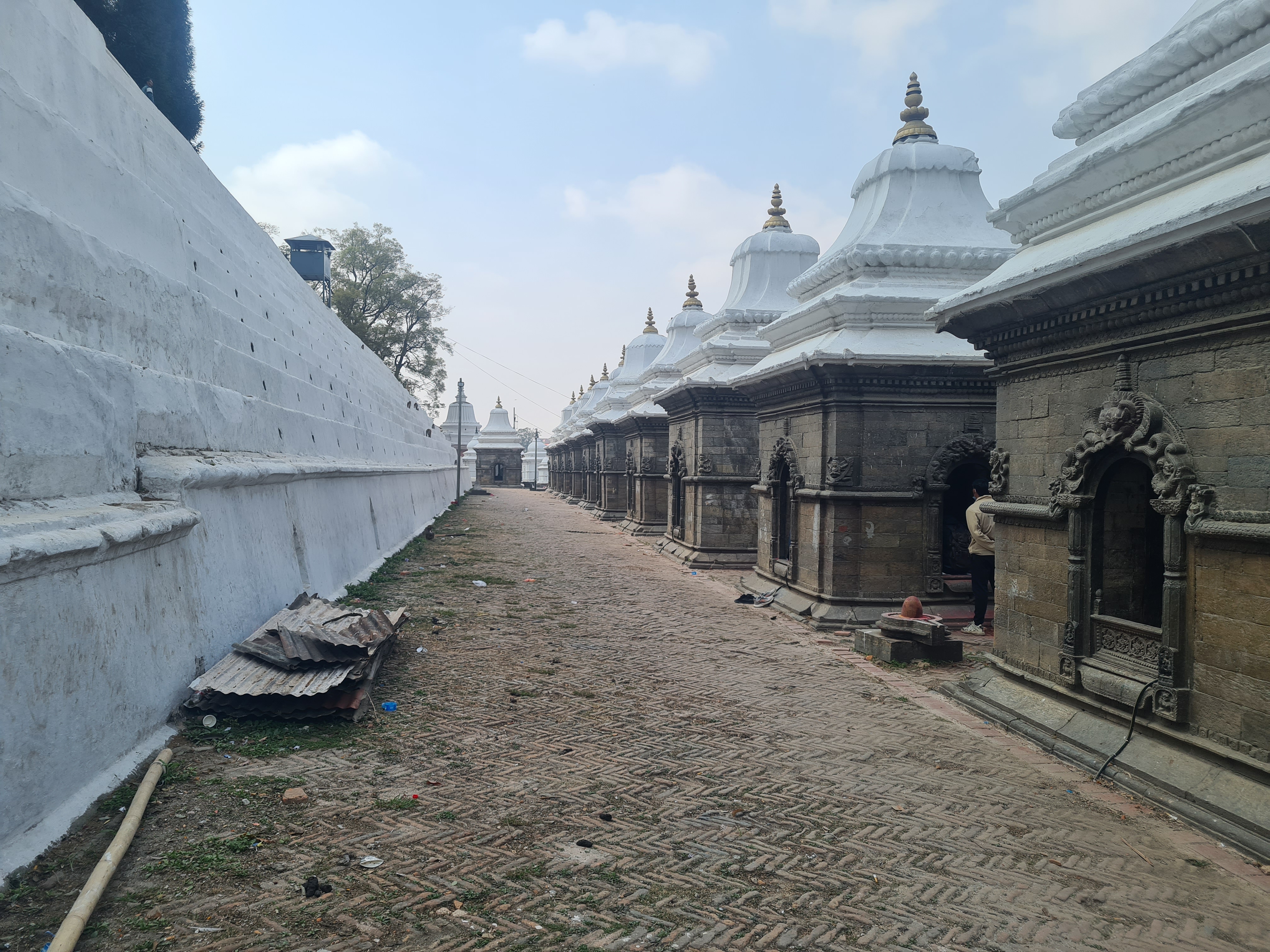 A row of buildings with white domes

AI-generated content may be incorrect.